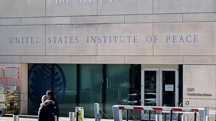Trump is fighting the Institute of Peace in court. Now, his name is on the building