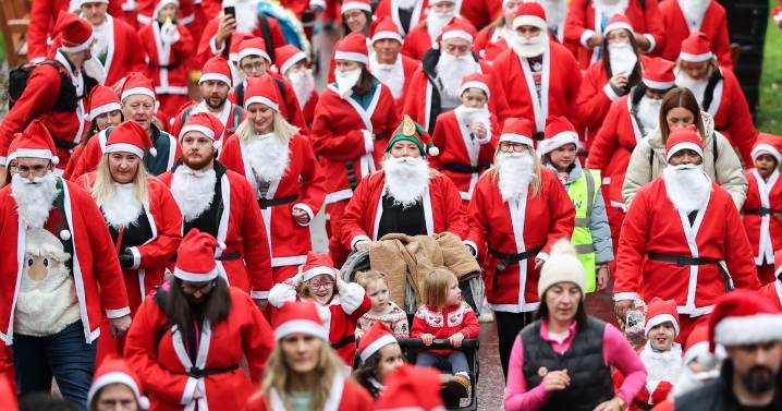 Hundreds of festive runners fill Edinburgh streets for this year's annual Santa Dash