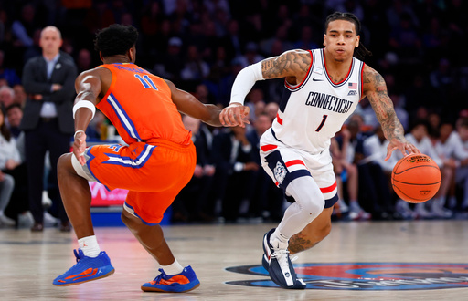 Ball scores 19 points as No. 5 UConn beats No. 18 Florida 77