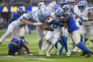 Rams clinch playoff spot with comeback win over Lions