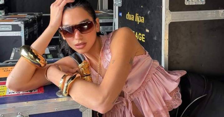 Dua Lipa’s Lace Top Photos Show Only a String Holding It Together
