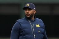 Former Michigan coach Moore detained by police after firing