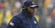 Former Michigan football coach jailed hours after firing
