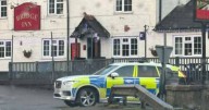 Armed police officers swarm on quiet Welsh town