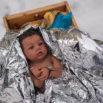 Church nativity scenes add zip ties, gas masks and ICE to protest immigration raids