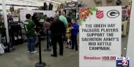 Packers players sign autographs for Salvation Army Monday night
