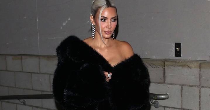 Kim Kardashian in Fur Coat & Skintight Pants Demands Attention
