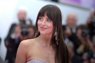 Dakota Johnson’s Triangle Scarf Is the Solution to Winter Hat Hair