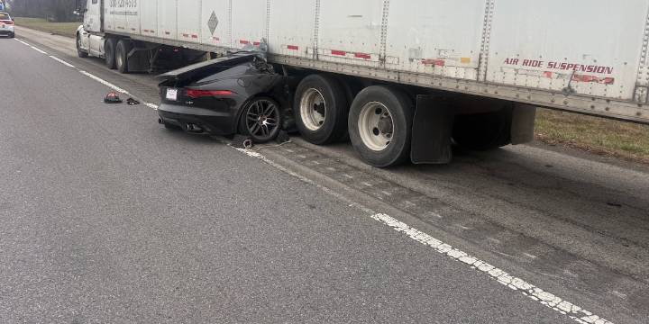 No injuries reported after car hits semi on I