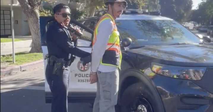 LA police arrest street safety activist for painting DIY crosswalk in Westwood