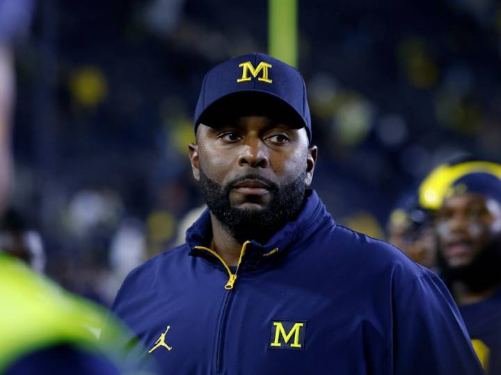 Fired Michigan football coach charged with home invasion and stalking