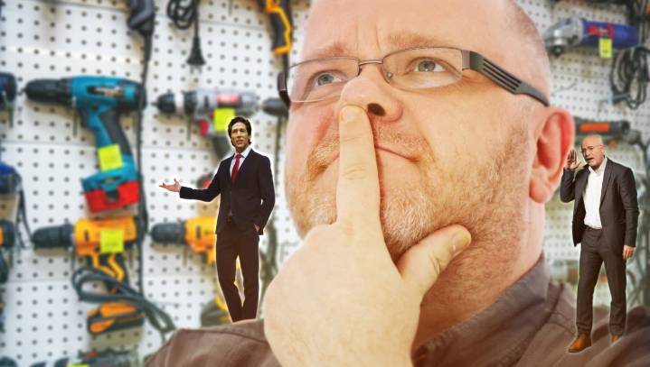 Tiny Versions Of Dave Ramsey, Joel Osteen Whisper In Man's Ear As He Agonizes Over Purchasing Expensive Power Tools