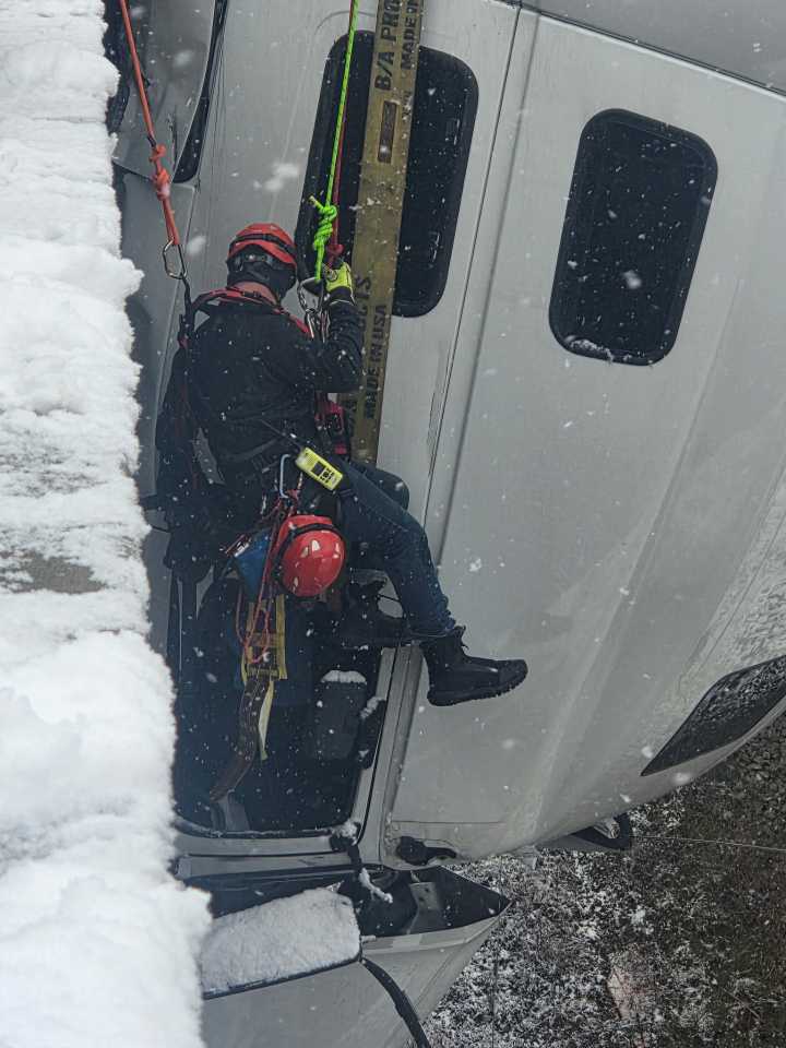 Driver walks away after being inside dangling truck cab for 5 hours