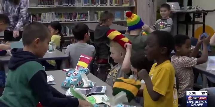 Group of 2nd graders in Ashwaubenon receive knitted winter hats that they designed