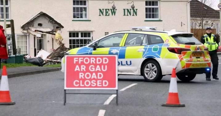Bulldozer smashes into South Wales pub and flattens car in 'targeted attack'