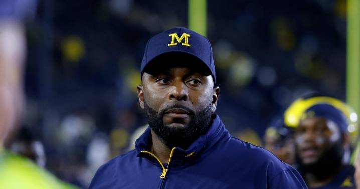 Fired Michigan football coach charged with home invasion and stalking