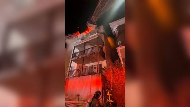 Firefighters battle flames at Dorchester triple decker
