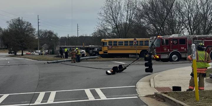 Cobb County school bus crashes into utility pole, taking down traffic lights at busy intersection