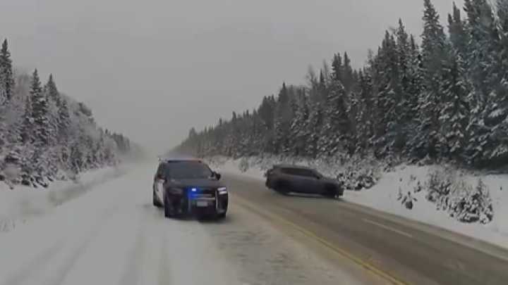 Video: Canadian police officer dives off roadway to escape out