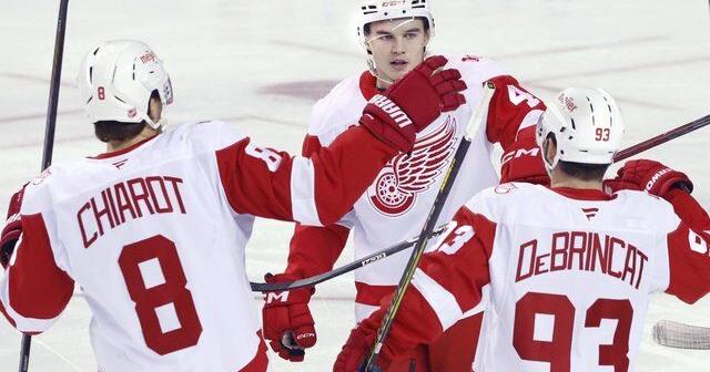 DeBrincat extends point streak, Red Wings hold off Flames for 4