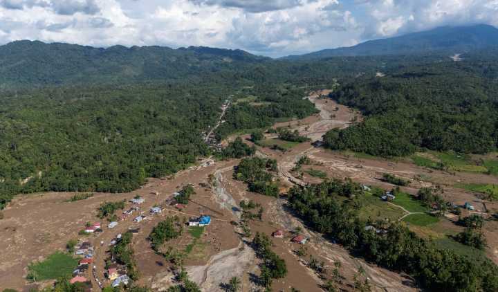 Indonesia races to find missing after massive floods, landslides