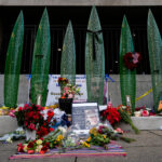 Man charged in National Guard shooting pleads not guilty during court appearance from hospital bed