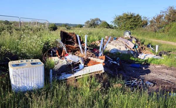 Mom helps cops track down son who dumped 680 pounds of junk on vacant property