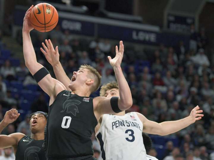Michigan State pulls away late to top Penn State in road opener