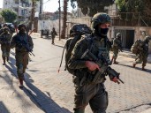 Young Palestinian dies in Israeli custody, dozens taken in West Bank raids
