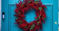 Brightly colored festive wreaths decorate iconic Scottish street