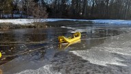 Firefighters rescue dog after fall through ice in Andover