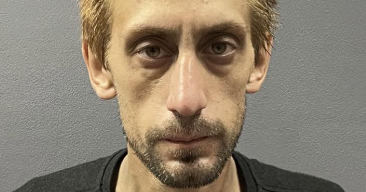 Man arrested after fleeing traffic stop in a stolen pickup and crashing into residence