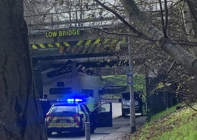Schoolchildren injured after bus roof ripped off ploughing into low bridge