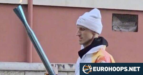 Achille Polonara carried the torch for the Winter Olympic Games in Italy