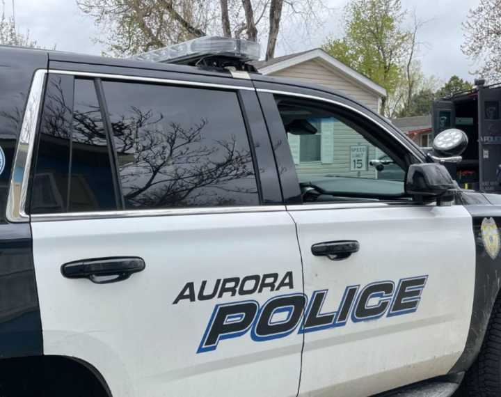 Fired Aurora police officer charged with assault, child abuse
