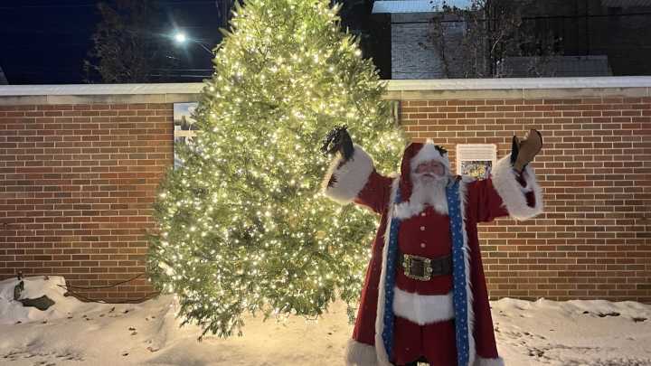 Santa lights up Christmas tree at Cheboygan's Parade of Lights