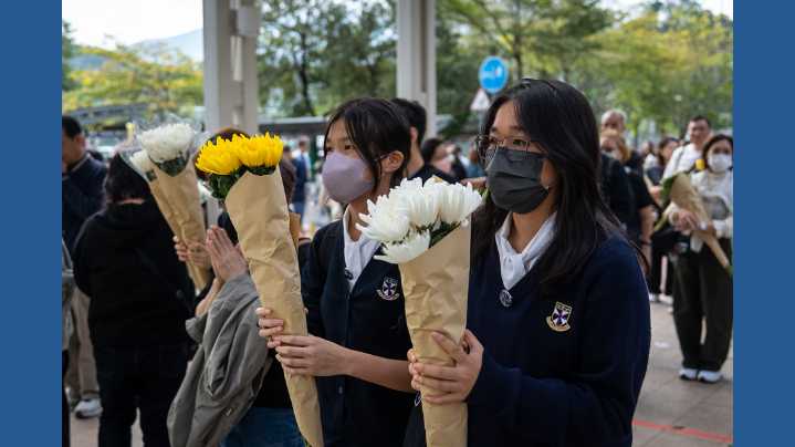 Hong Kong fire probe reveals unsafe netting as public mourns and government stifles dissent