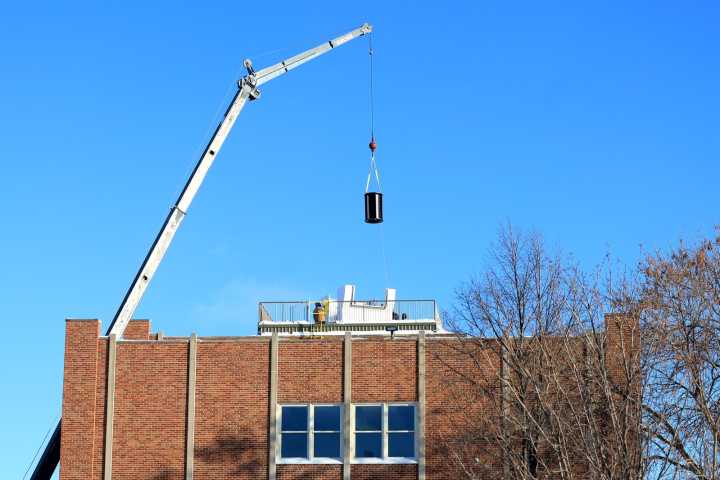 UND hoists laser lab equipment onto top of Witmer Hall Wednesday