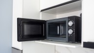 Turn A Microwave Eyesore Into A Stylish Appliance Garage With An Antique Flair