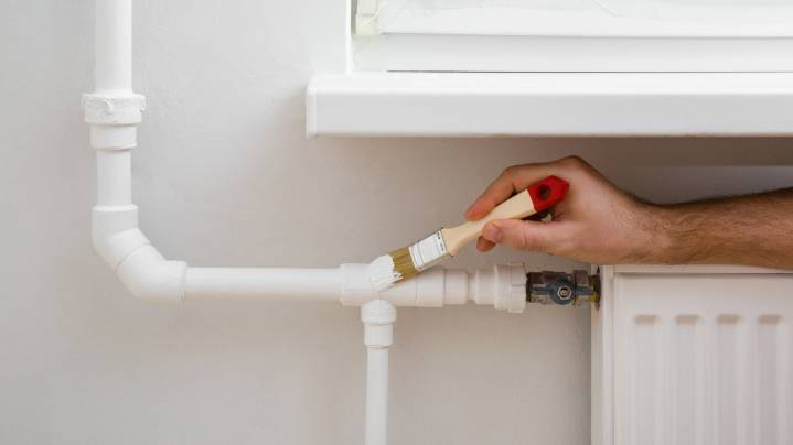 Hide An Exposed Pipe Eyesore With This Clever DIY That Even Your Cat Will Love