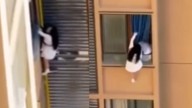 Chinese Woman Hangs From 10th-Floor Window To Escape ‘Shirtless’ Man’s Wife: ‘Why Risking Life For An Idiot?’