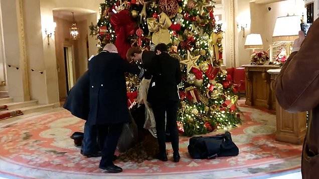 Merry S***tmas: Wealth protesters dump ‘manure’ under the Ritz hotel’s iconic Christmas tree