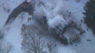 Crews battle fire with extensive damage to Mass. home