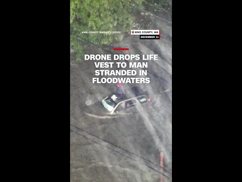 Drone drops life vest to man stranded in floodwaters