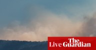 Australia news live: disaster assistance announced for NSW bushfire victims after up to 16 homes destroyed