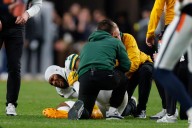 Packers' Micah Parsons exits with knee injury