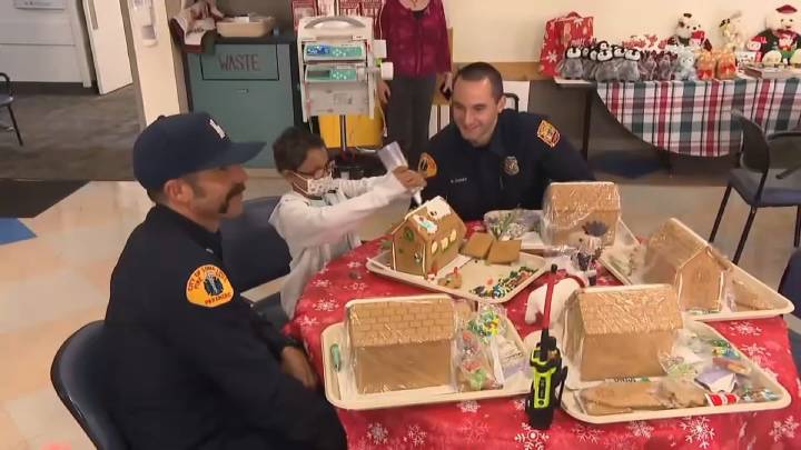 Pediatric patients in Loma Linda build gingerbread houses with firefighters' help