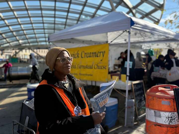 At a farmers market, news on the homeless, hawked by a woman who lived it