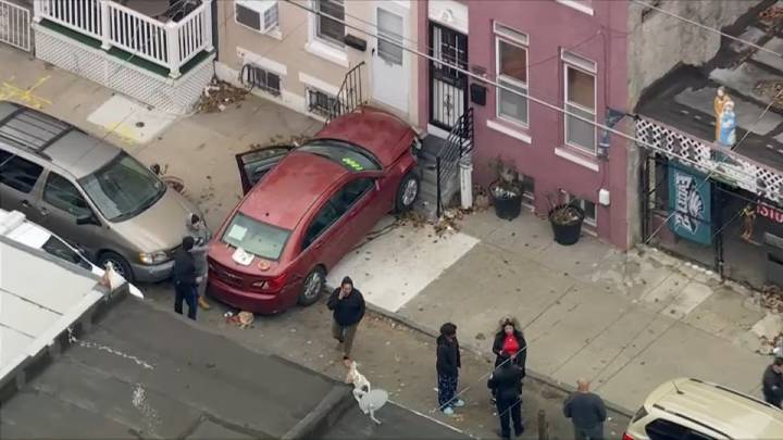 Officer hit by car that struck North Philly home, source says