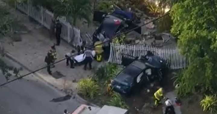 Four injured after two‑car crash tears through North Miami yard